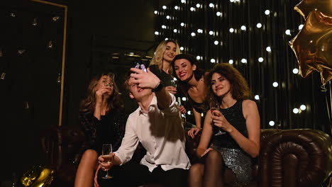 group of people take a selfie at a new year's eve party