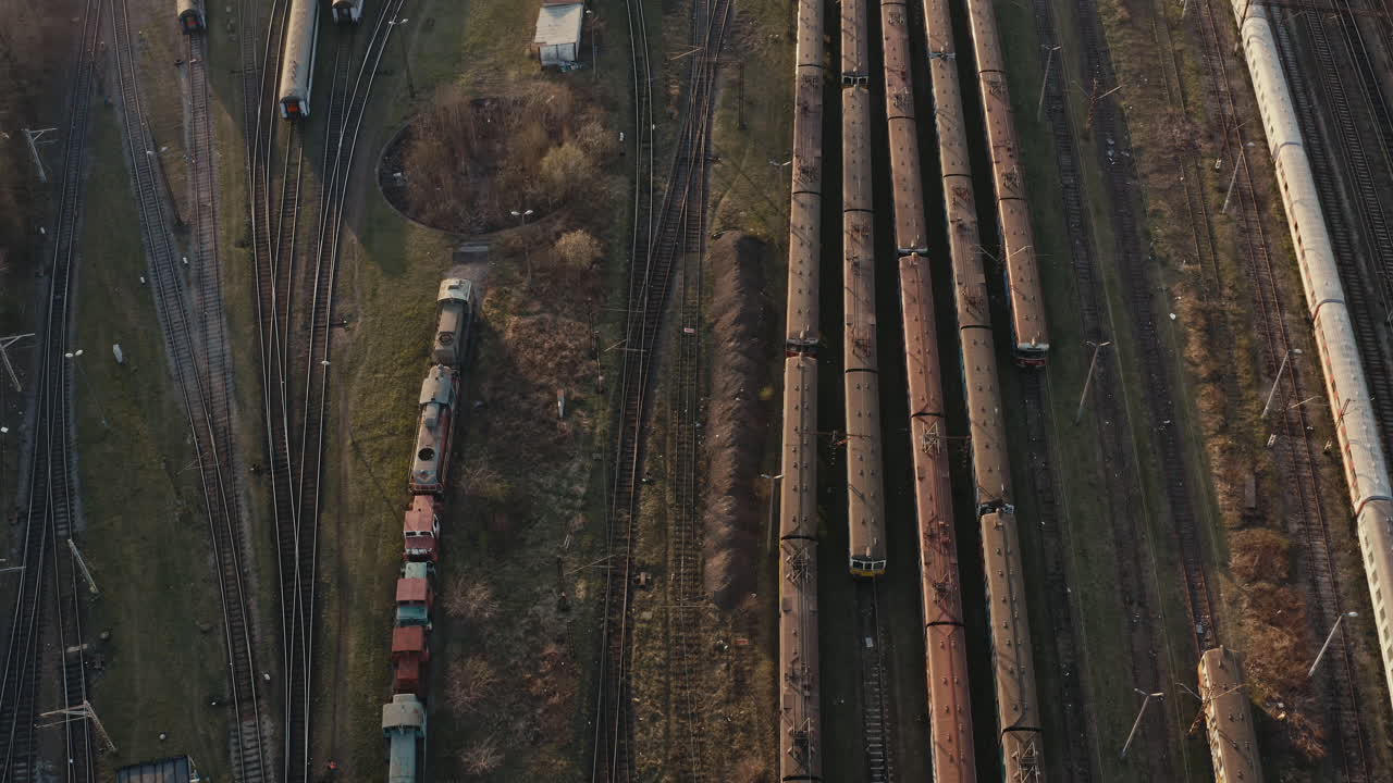 Aerial View of a Train Depot with Old Trains and Tracks