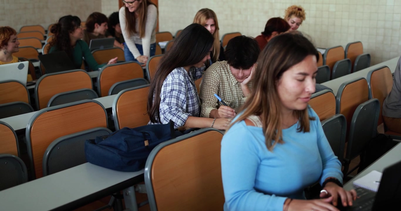 University Students Working on Laptops in Lecture Hall