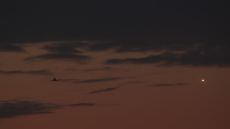 airplane flying at twilight