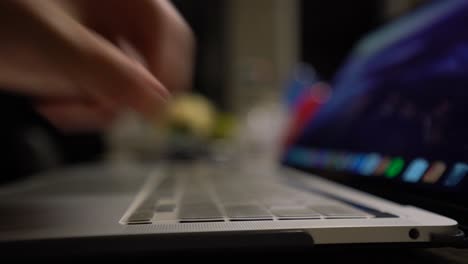 Applying-keyboard-cover-on-Apple-MacBook-Pro-laptop-to-protect-keys-from-dust,-dirt,-and-water