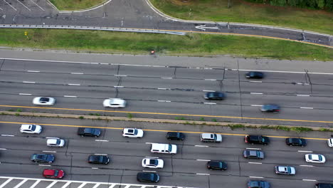 an aerial view over a busy parkway in the evening at rush hour