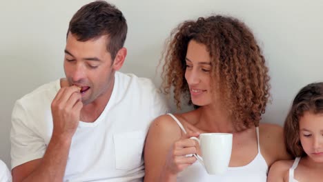 Happy-family-having-breakfast-