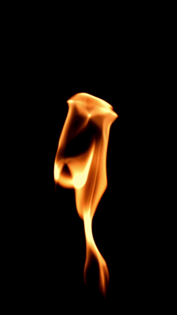 Abstract Golden Flame Flickering on Black Background