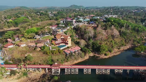 a magnificent village in thailand, home to the iconic mon bridge, a historic landmark for the mon people