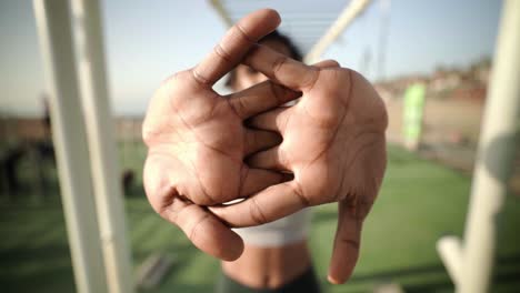 arms reach stretching prior to intense workout by black woman