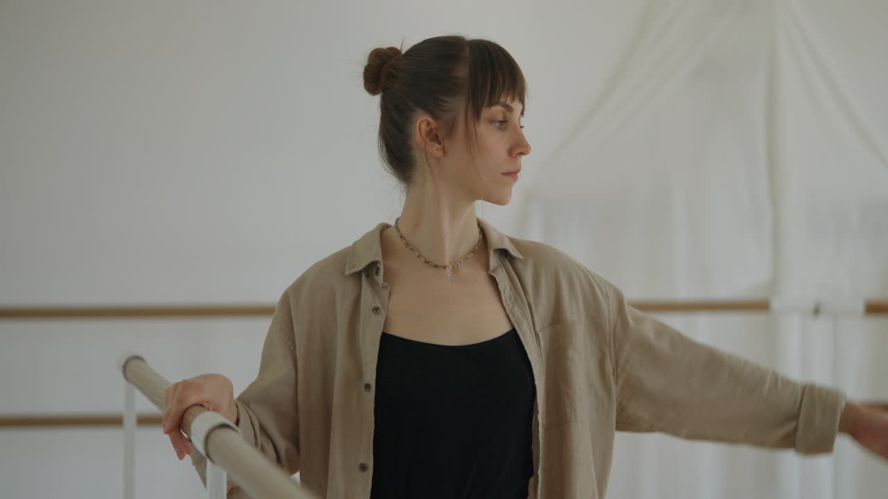 Graceful Ballet Dancer Practicing at the Barre