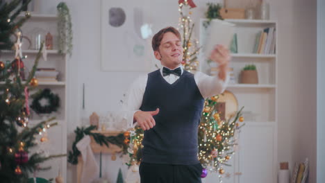 Man-video-chatting-on-digital-tablet-at-home-during-Christmas