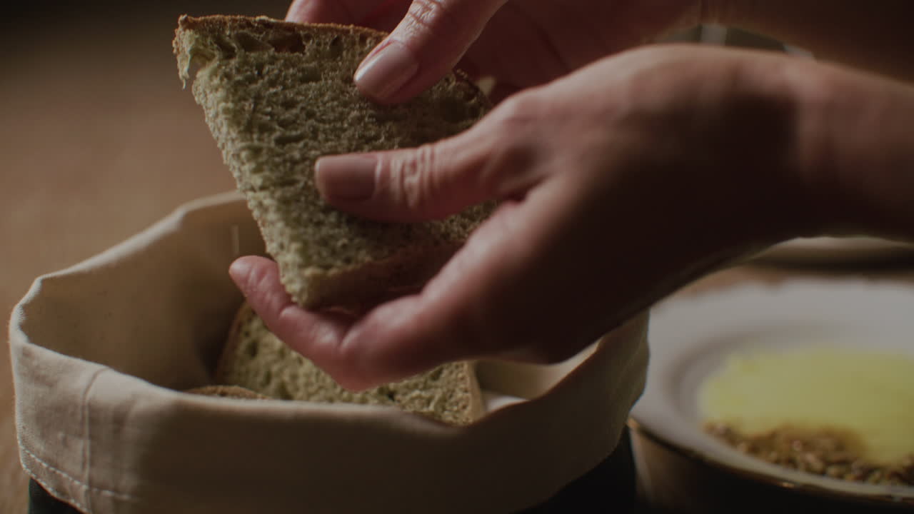 Hand picking slices of bread