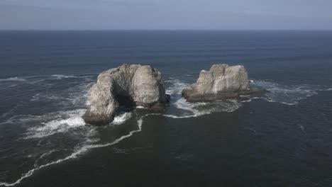 epic aerial orbit of twin rocks off the oregon coast of rockaway beach