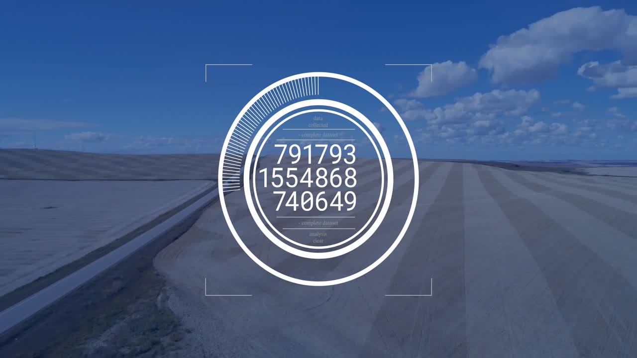 Un HUD ad anello appare e poi scorre letture numeriche per la mira, mentre sovrappone un canale e sabbia.