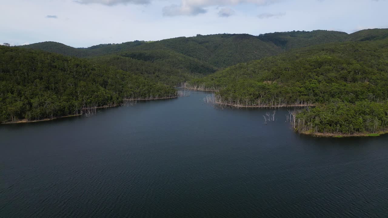 Rising aerial views of Advancetown Lake near the Western Boat Ramp on the Gold Coast Hinterland.