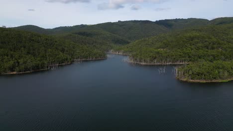 Rising aerial views of Advancetown Lake near the Western Boat Ramp on the Gold Coast Hinterland.