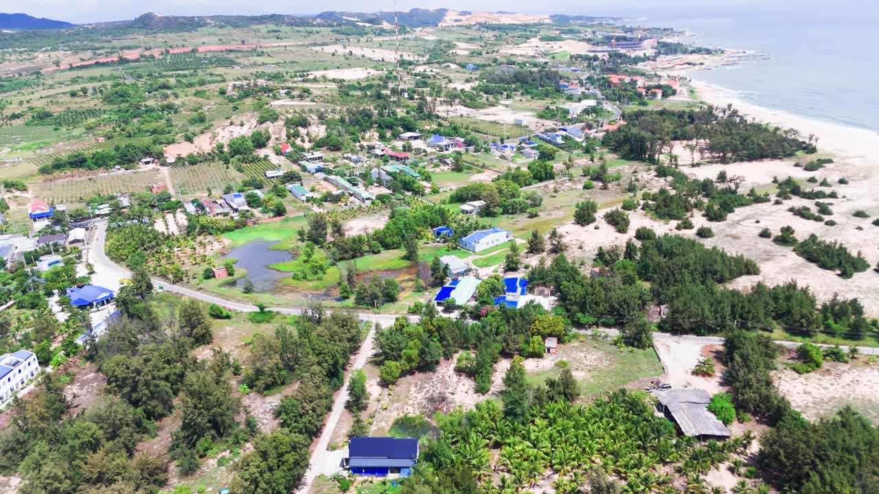 Aerial View Tilt of the Town Near the Coast in Binh Thuan (Vietnam) During the Rainy Season