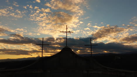 three religious crosses silhouette against of sunset sky symbol of christianity