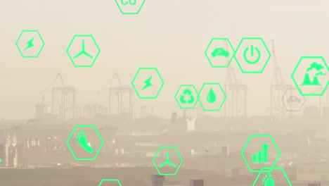 Multiple-green-energy-icons-floating-against-aerial-view-of-cityscape