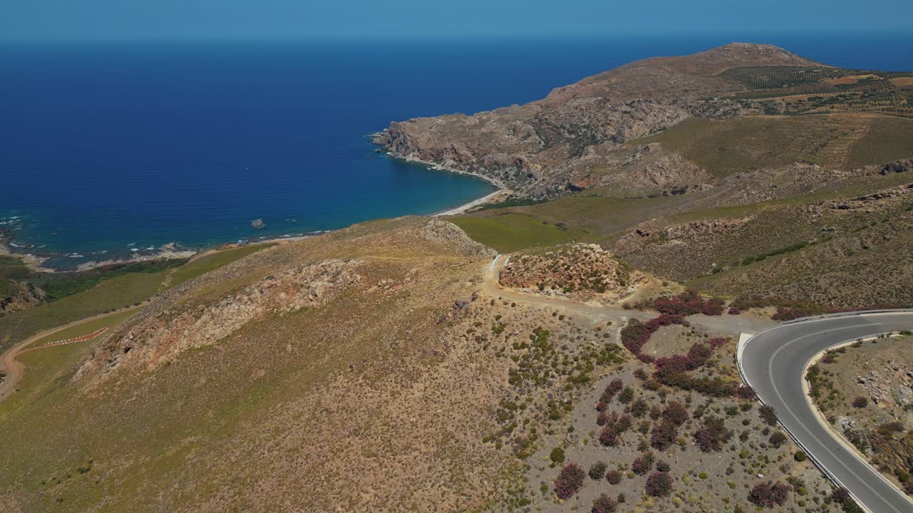 Winding Road On The Mountain Overlooking The Blue Sea In Chania, Crete, Greece. - aerial shot