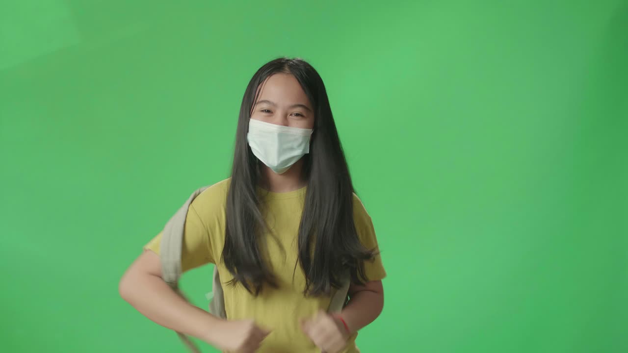 Asian Girl Student Wearing Mask And Running To School On Green Screen Chroma Key