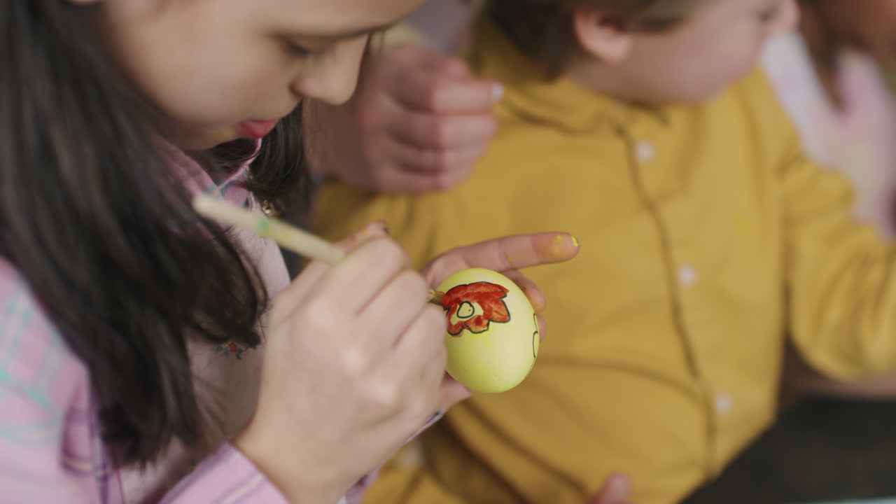 Girl Painting on Easter Egg