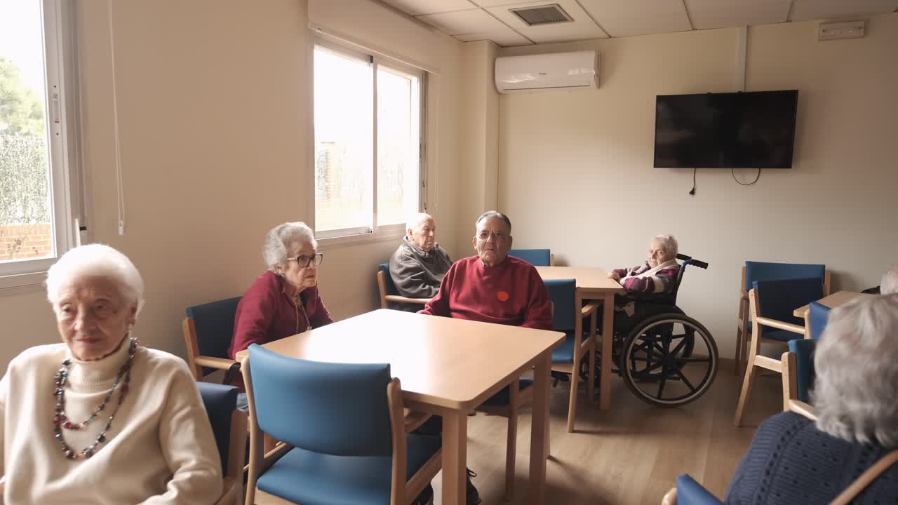 Old people gathering in lounge of retirement home