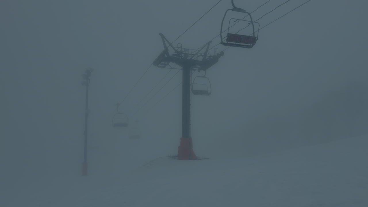 Winter ski resort lift surrounded by snow in Nagano