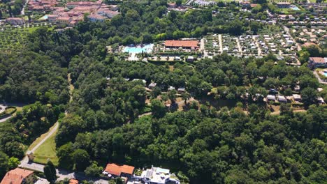 Aerial-Shot-of-Weekend-Glamping-Camping-Site-Near-Lake-Garda,-Italy