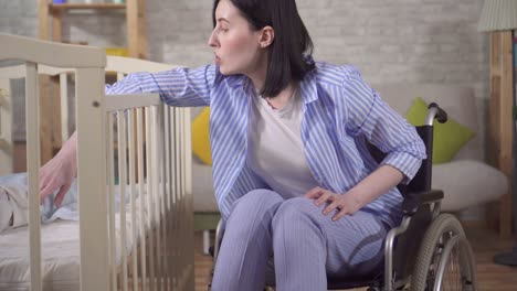 young woman with a disability and a newborn