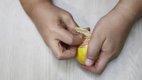 sequential frames showing the peeling of an orange