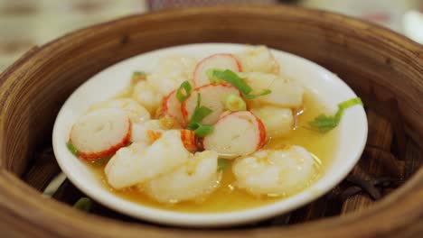 steamed scallops in bamboo steamer, garnished with green onion and chili, vibrant colors