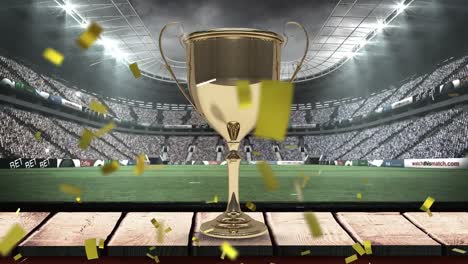 Animation-of-confetti-falling-over-gold-cup-in-rugby-field-sports-stadium