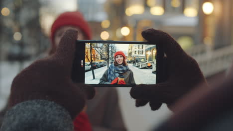 taking a selfie in the city on a snowy day