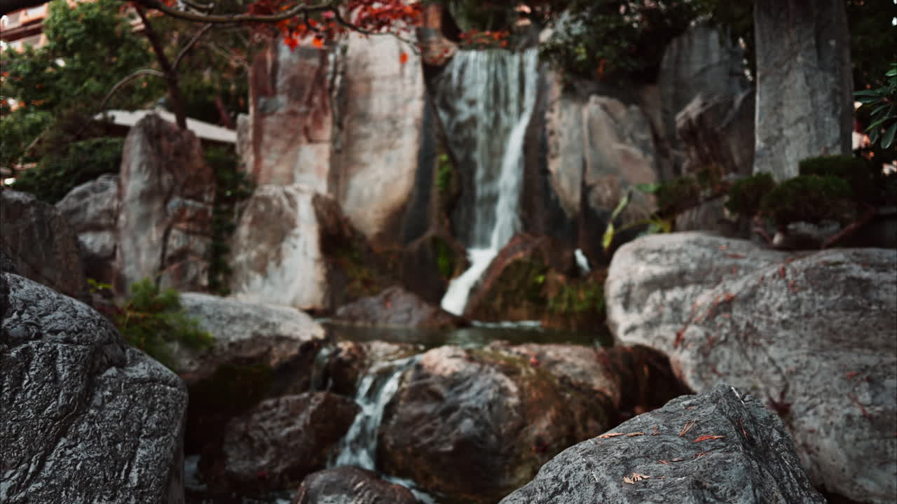View of the a small waterfall in the Japanese Gardens in Monaco