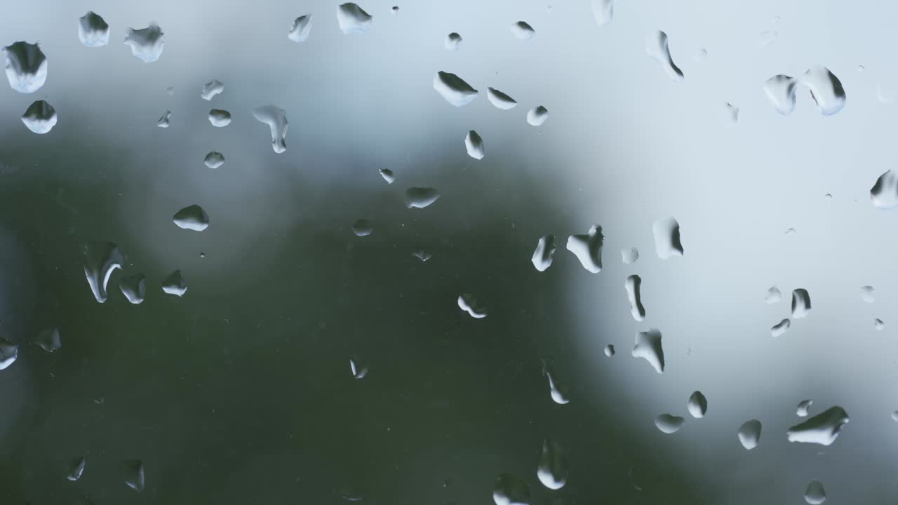 Zooming In Shot Of Wet Raindrops On Window Glass Surface