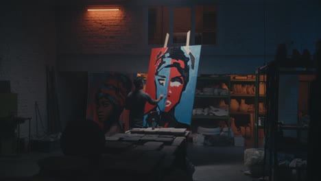 artist painting portraits in a studio