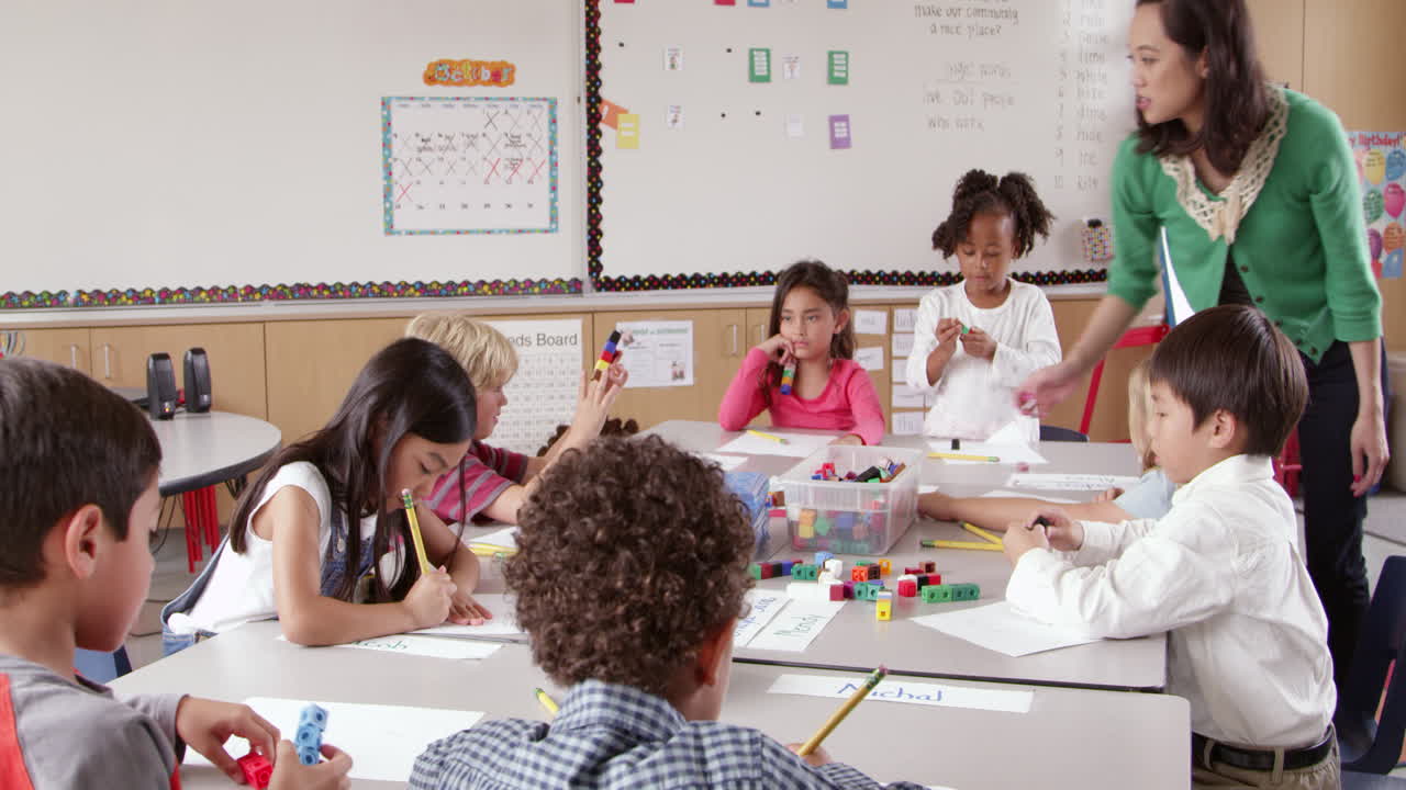 Teacher and kids use blocks in class, low angle shot on R3D