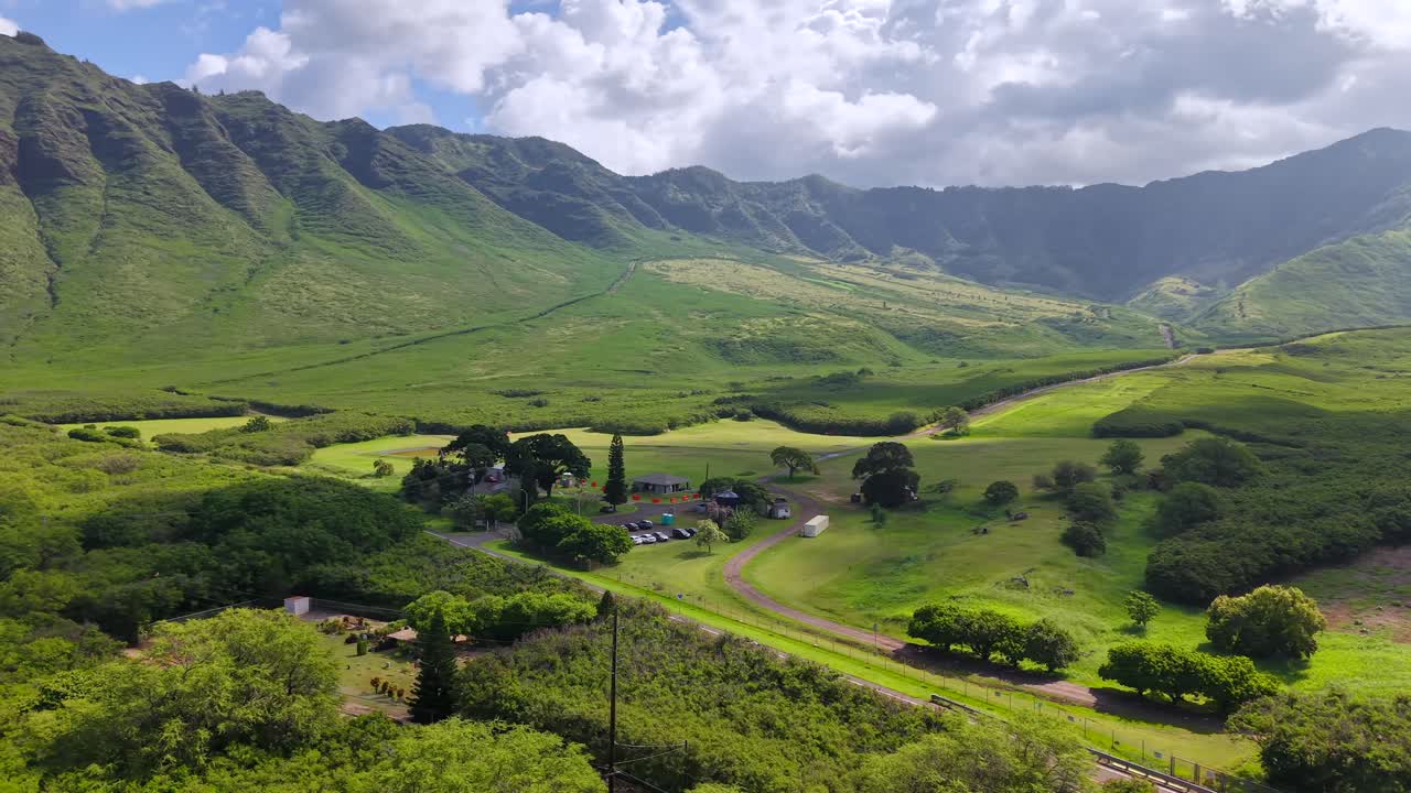 Lush green Makua Valley surrounded by the Waianae mountains in Oahu, aerial