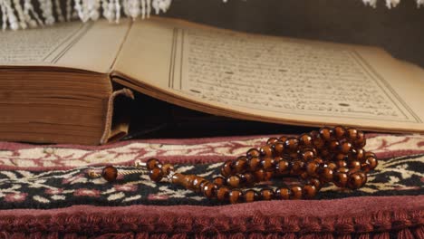 prayer beads on the quran page