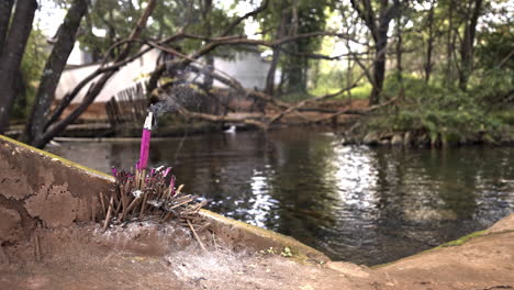 incense burning at water source in eryuan county, yunnan, china