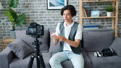teenager reviews smartwatch and smartphone