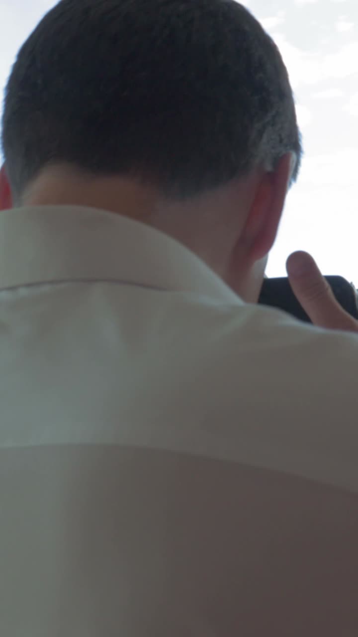 Photographer taking pictures of the city from a window