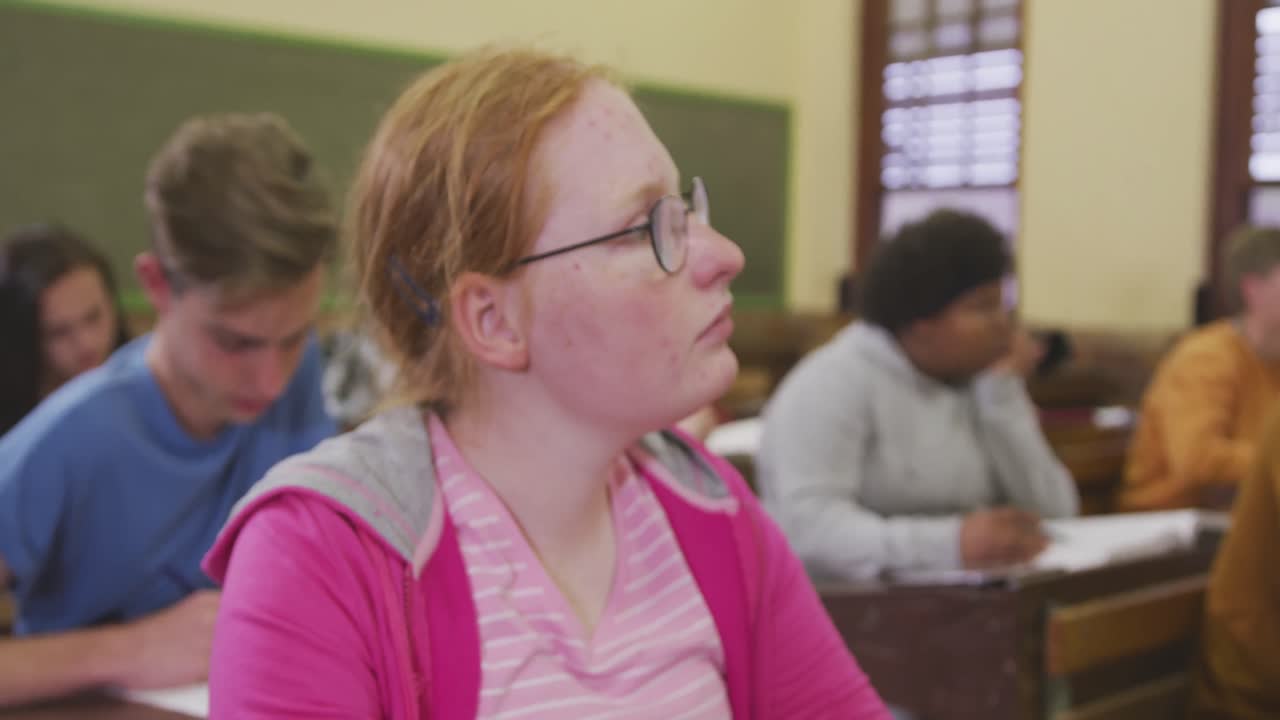 Student concentrating in high school class