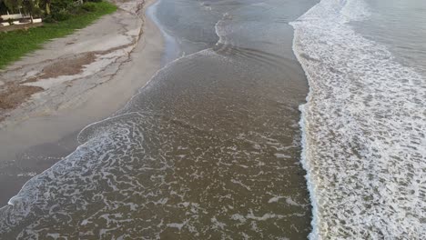 Waves-crashing-on-the-beach-of-Tamarin-Bay-with-a-view-tilting-towards-La-Tourelle-mountain
