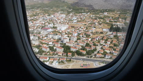 view of hvar in croatia seen from the airplane window - pov