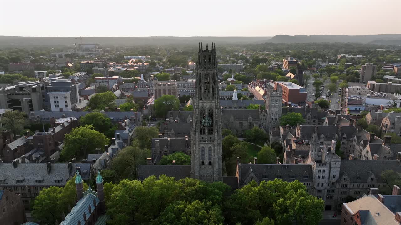 Historic harkness tower in old Yale university of New Haven, Connecticut. Aerial orbit shot . Historic buildings and houses in gothic style