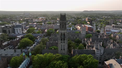 historic harkness tower in old yale university of new haven, connecticut. aerial orbit shot . historic buildings and houses in gothic style