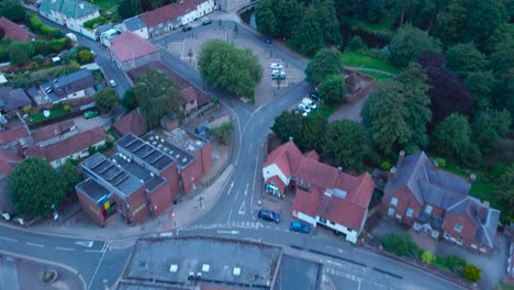 4k aerial drone footage over thetford with covid-19 vaccination centre in car park fly by in thetford, norfolk, england