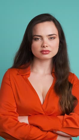 displeased woman shaking head on blue background