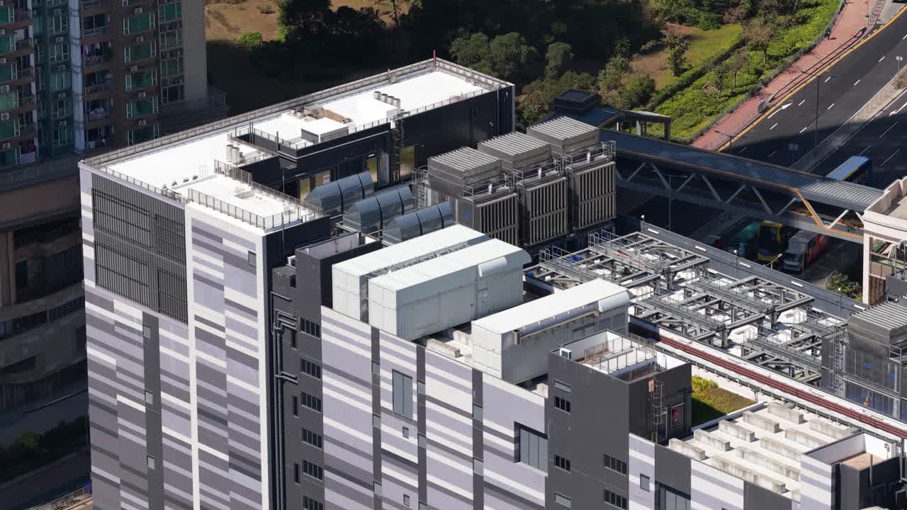 Aerial drone video of a large scale data center in Hong Kong, China, showcasing big data processing, artificial intelligence and machine learning infrastructure, colocation services, and cloud storage