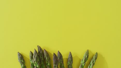 Video-of-fresh-asparagus-with-copy-space-over-green-background