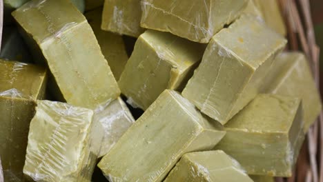 pile of wrapped green soap bars